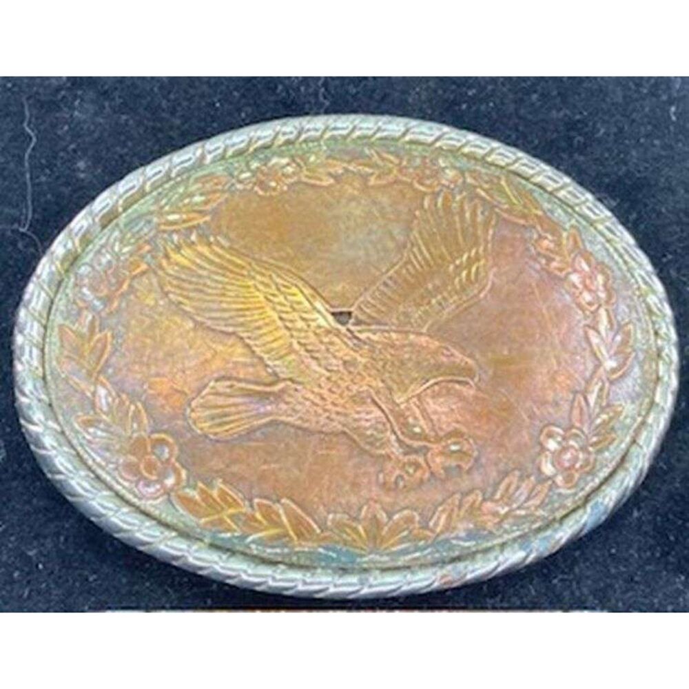 1970s/80s Wells Buckle Company (USA) belt buckle with a copper tone flying bald